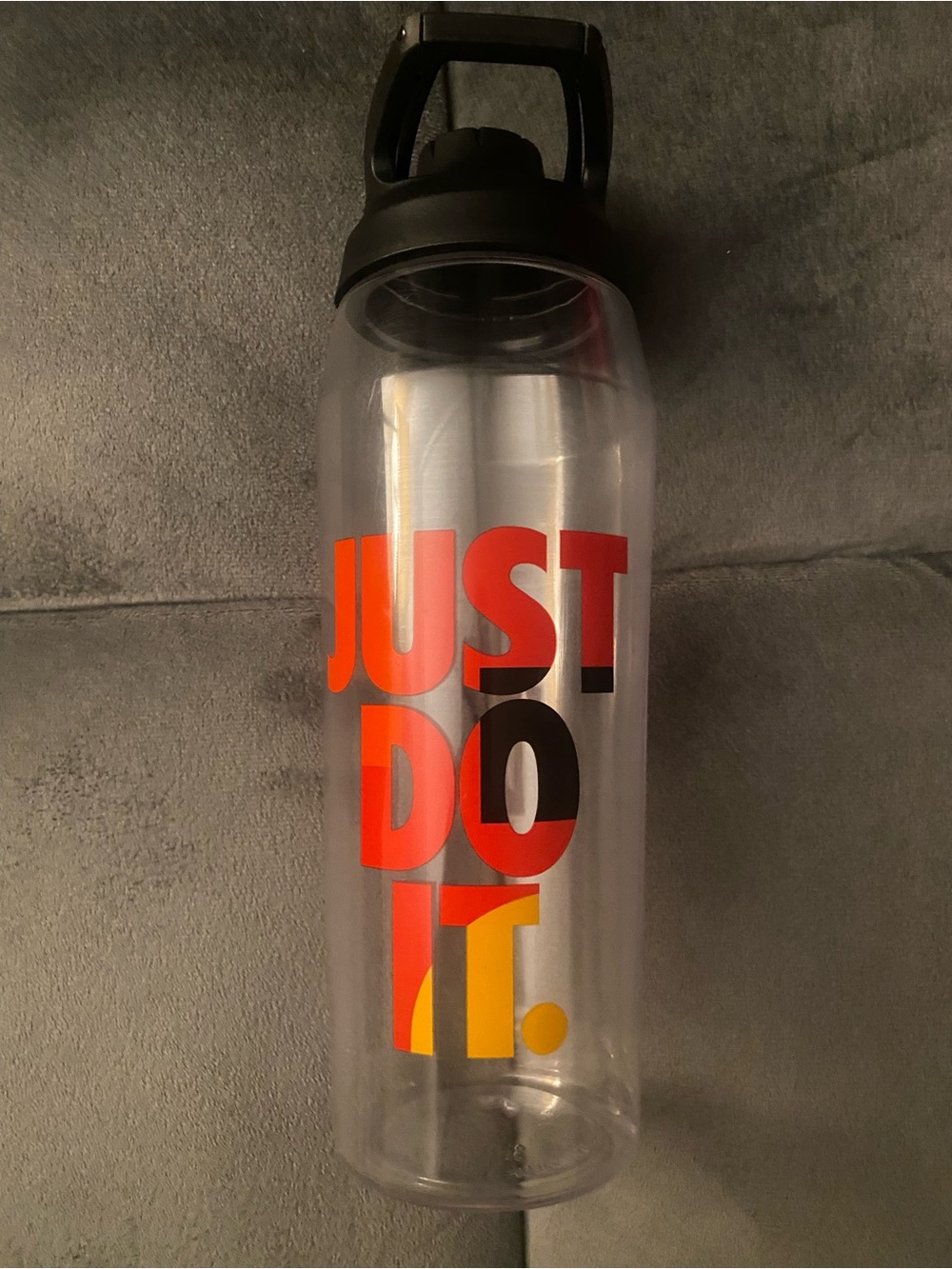 Nike Clear Bottle with Black Lid and Red, Orange, Yellow Graphic